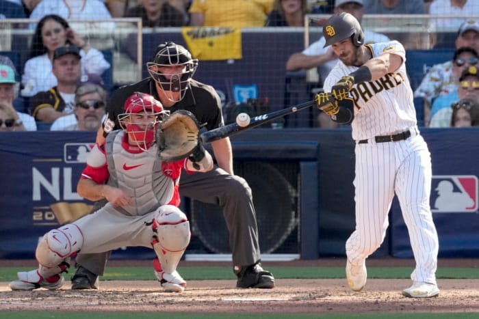 Padres catcher Austin Nola rips an RBI single off his brother, Phillies righthander Aaron Nola, in Game 2 of the NLCS.